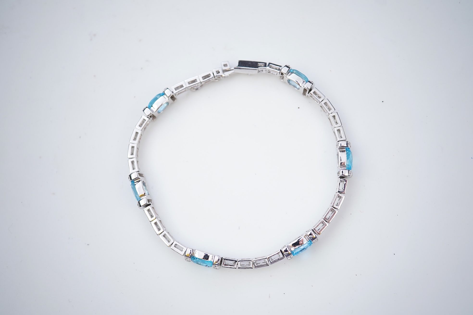 A blue topaz and diamond bracelet